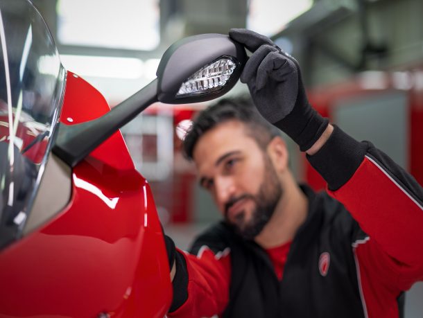 Mechanic looking at a motorcycle